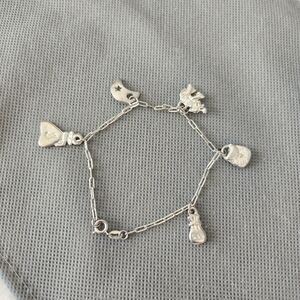 Eley silver tone bracelet with charms